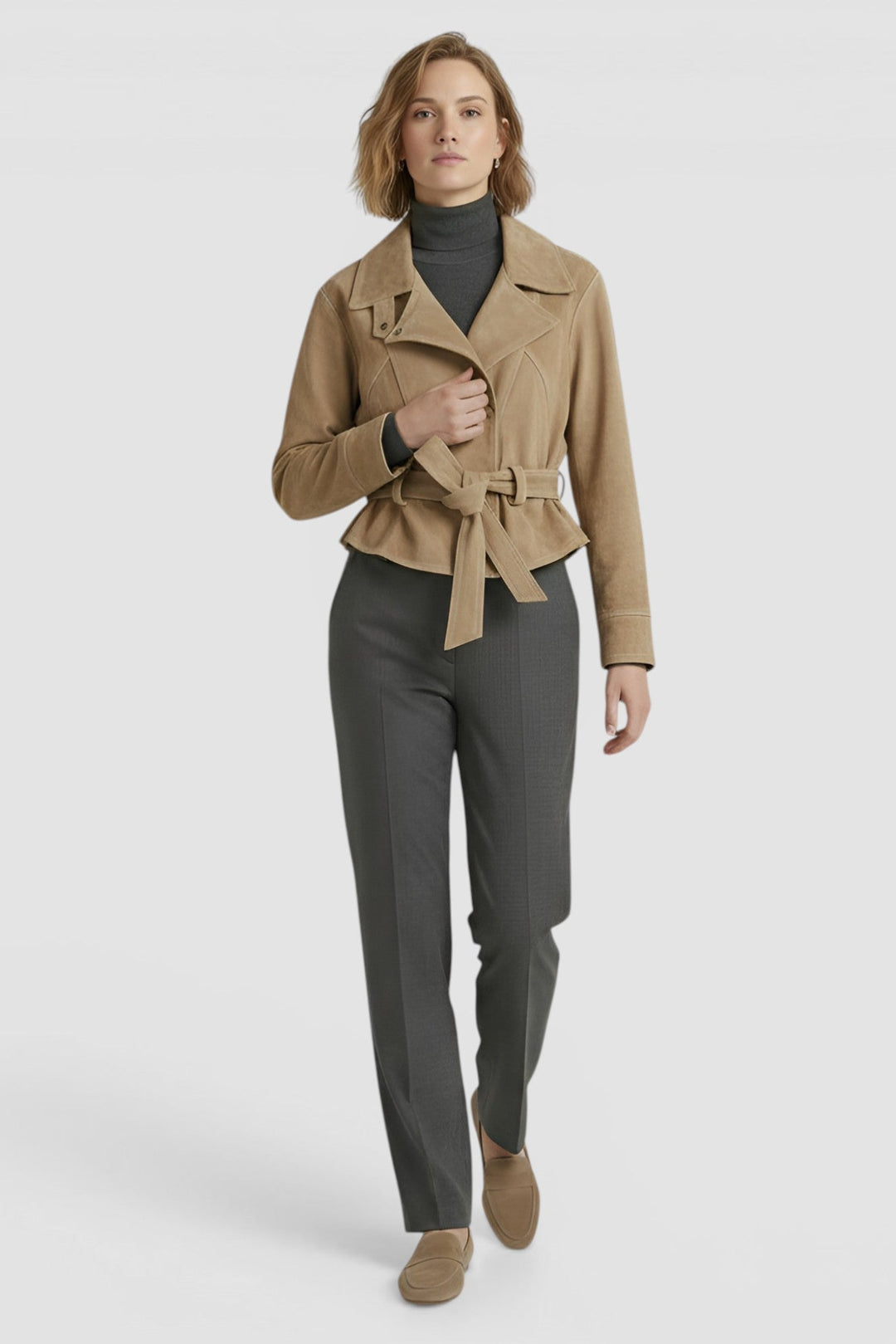 ADELINE - Model wearing tan suede belted jacket and grey trousers