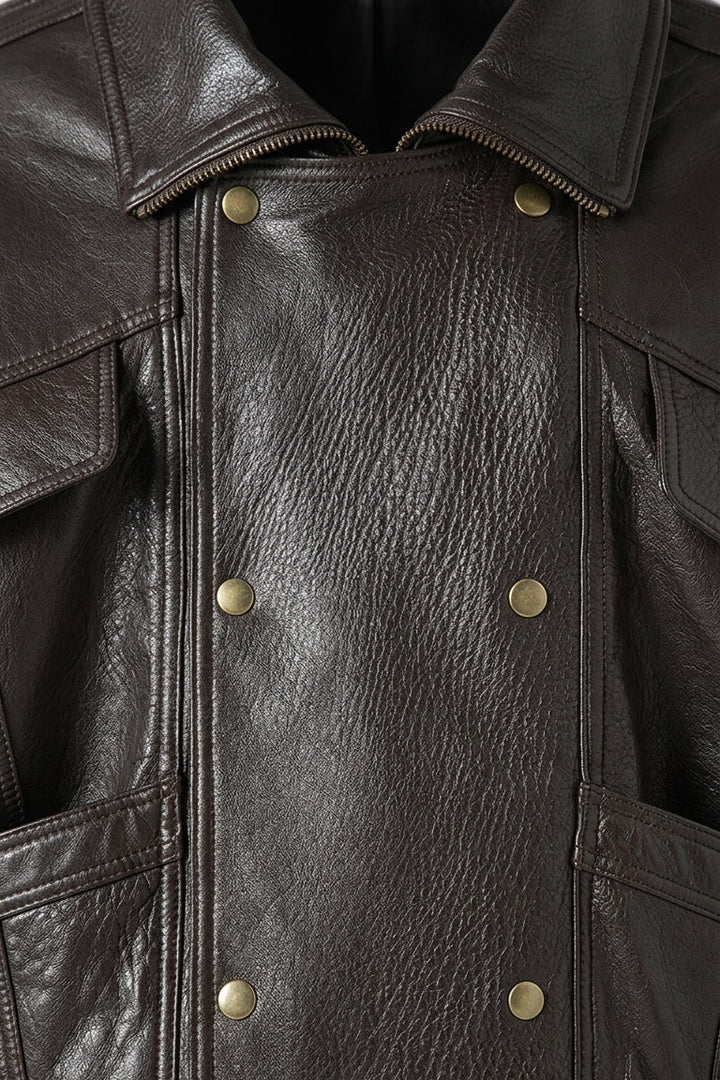 AINSLEY - Detailed shot of leather jacket pockets and buttons