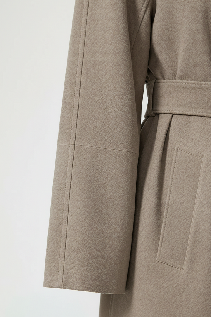 AURORA - Taupe suede trench coat detail, close-up of sleeve seam