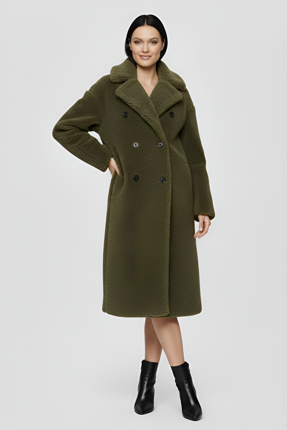 Close-up of a beige trench coat collar on a light gray background