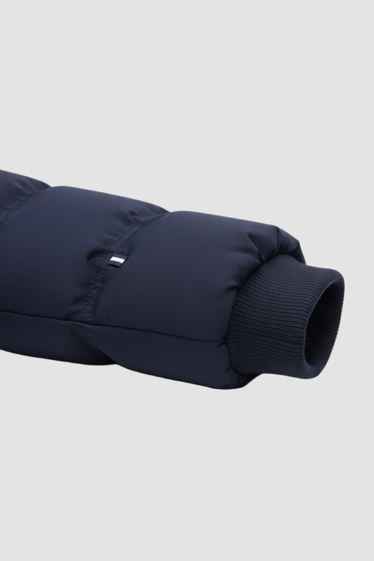 Navy blue puffer jacket on a light gray background