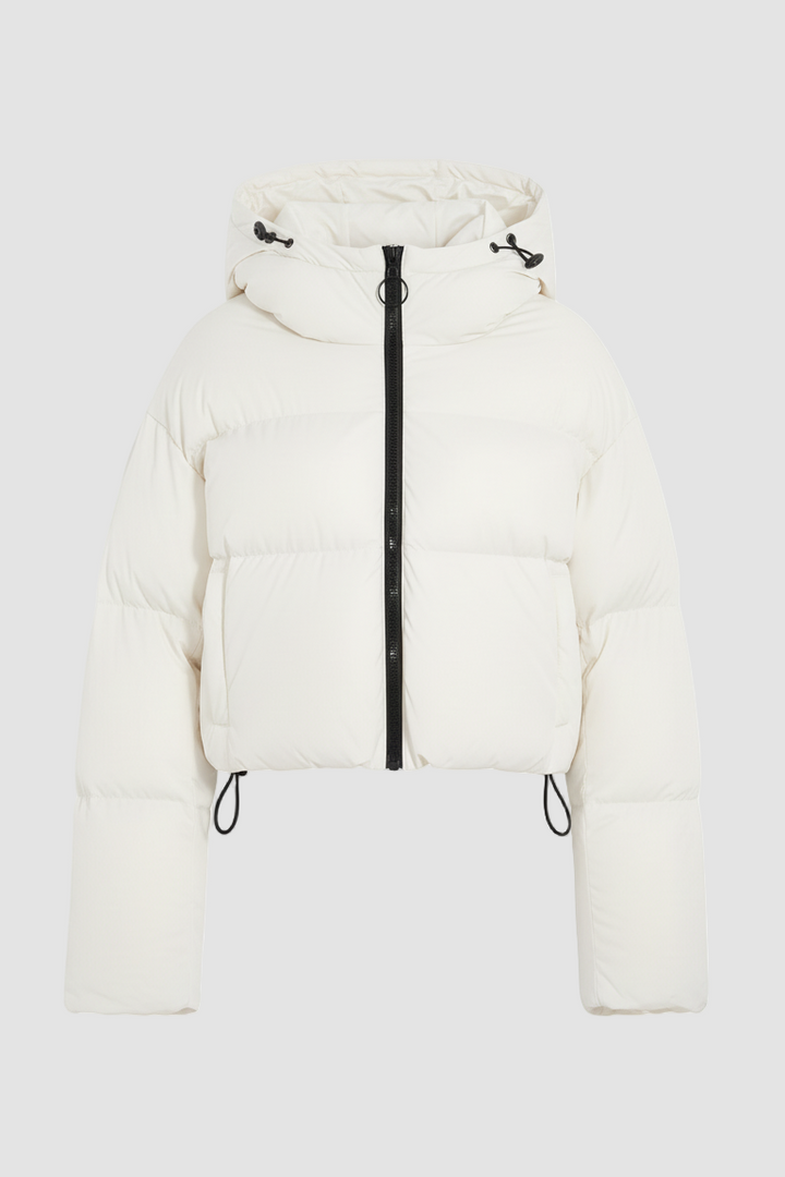 White puffer jacket with a black zipper on a white background