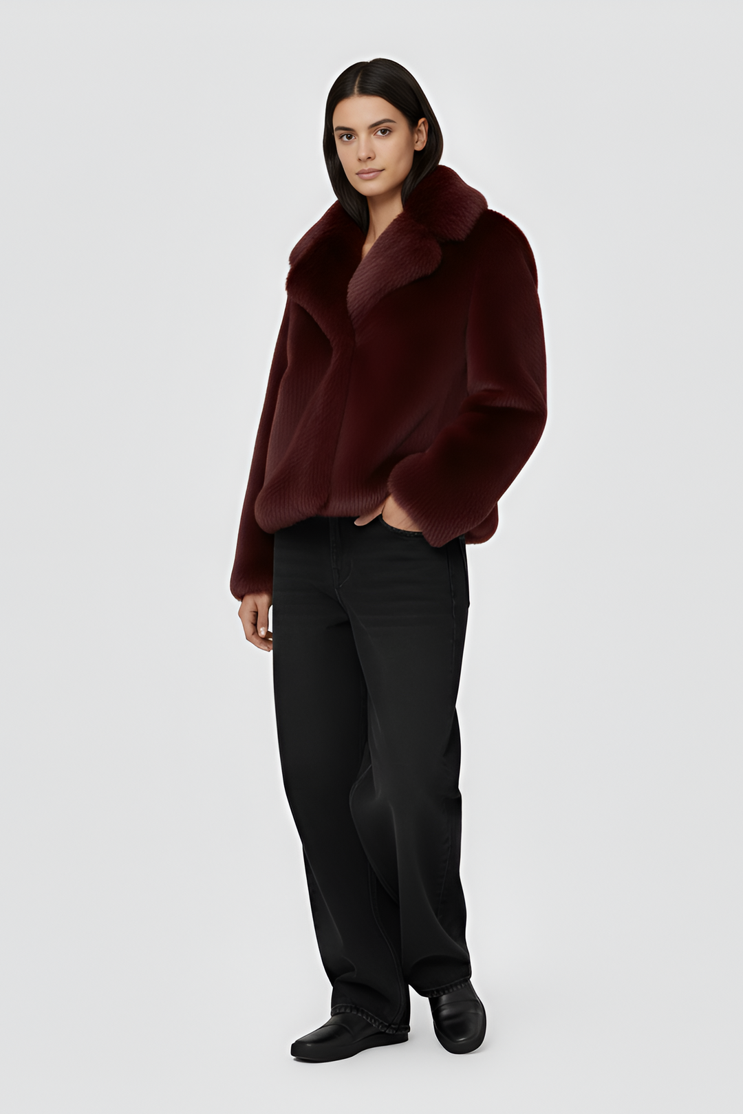 A burgundy fur coat against a white background.