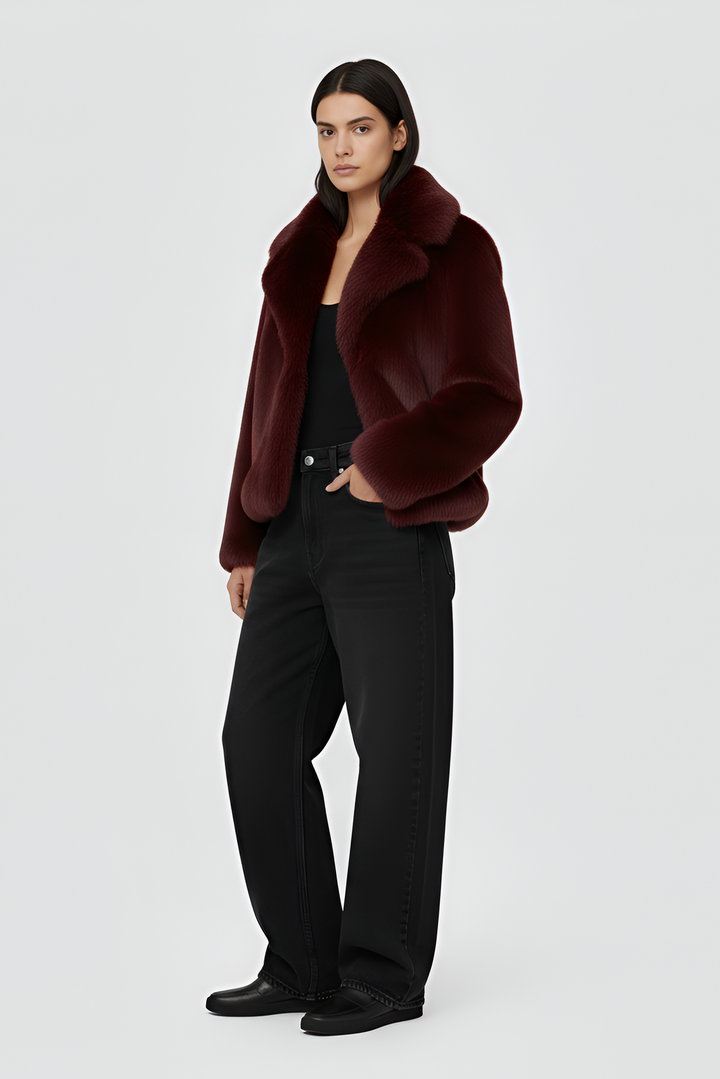 A burgundy fur coat against a white background.
