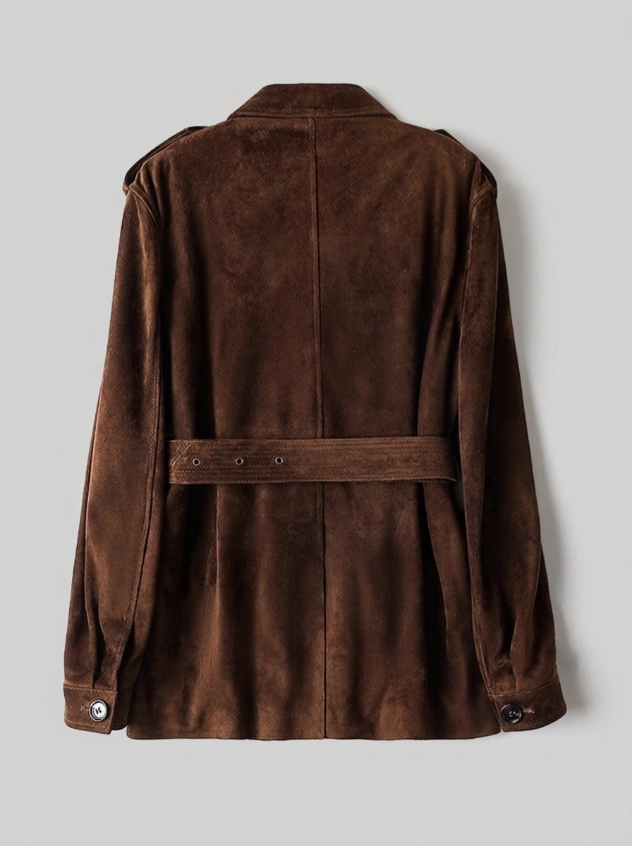 A dark brown suede jacket shown from the back, featuring a matching waist belt with metal eyelets, set against a neutral light gray background.