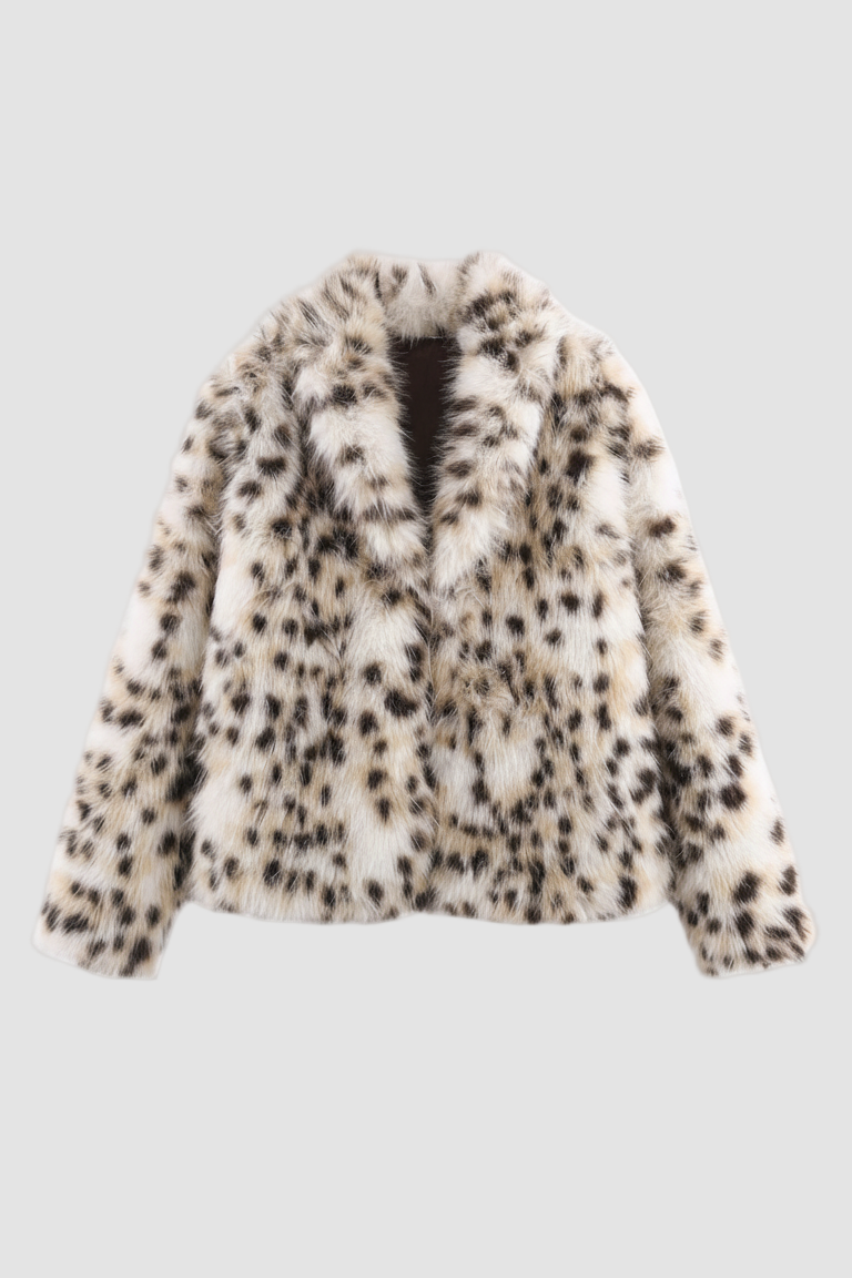 A fluffy white jacket featuring a black pattern against a white backdrop.