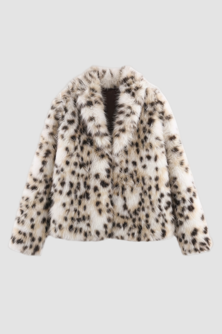 A fluffy white jacket featuring a black pattern against a white backdrop.