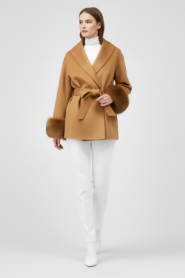 Woman wearing a brown coat with a belt on a white background