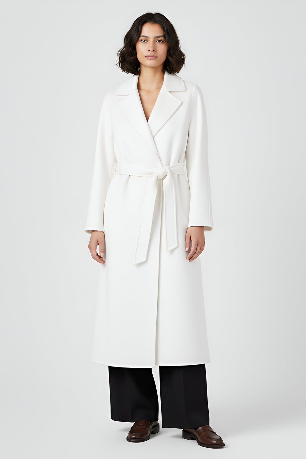 Woman wearing a white coat on a plain background