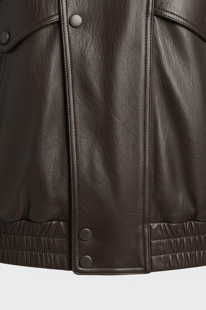 BRISTOL - Brown leather jacket, front close-up, emphasizing texture and sleeve design