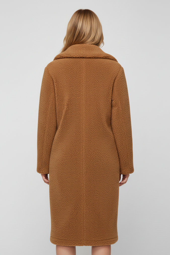 Back profile of the TALYNE long teddy coat highlighting thick warm construction and pockets.