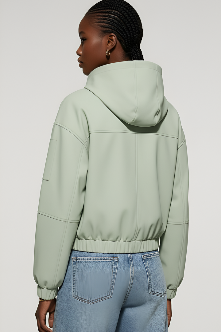 Back view of the MAERIS trench coat featuring hood design and clean lines.