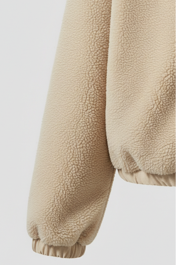 Beige fleece jacket on a light gray background