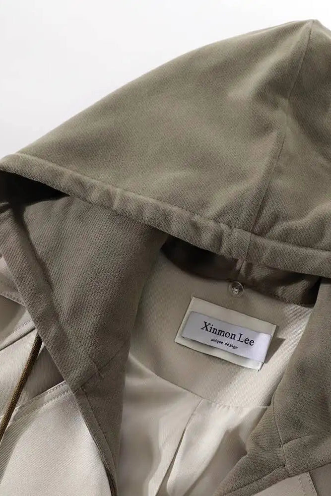 Beige hooded jacket with a visible label on a white background