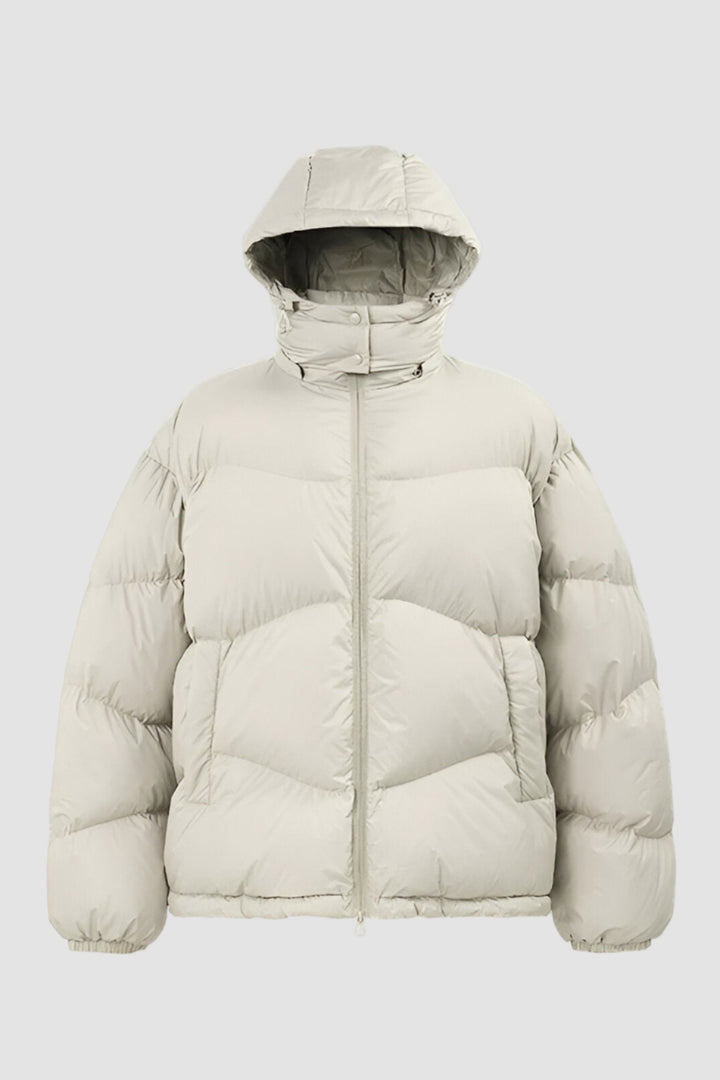 Beige puffer jacket with a hood on a white background