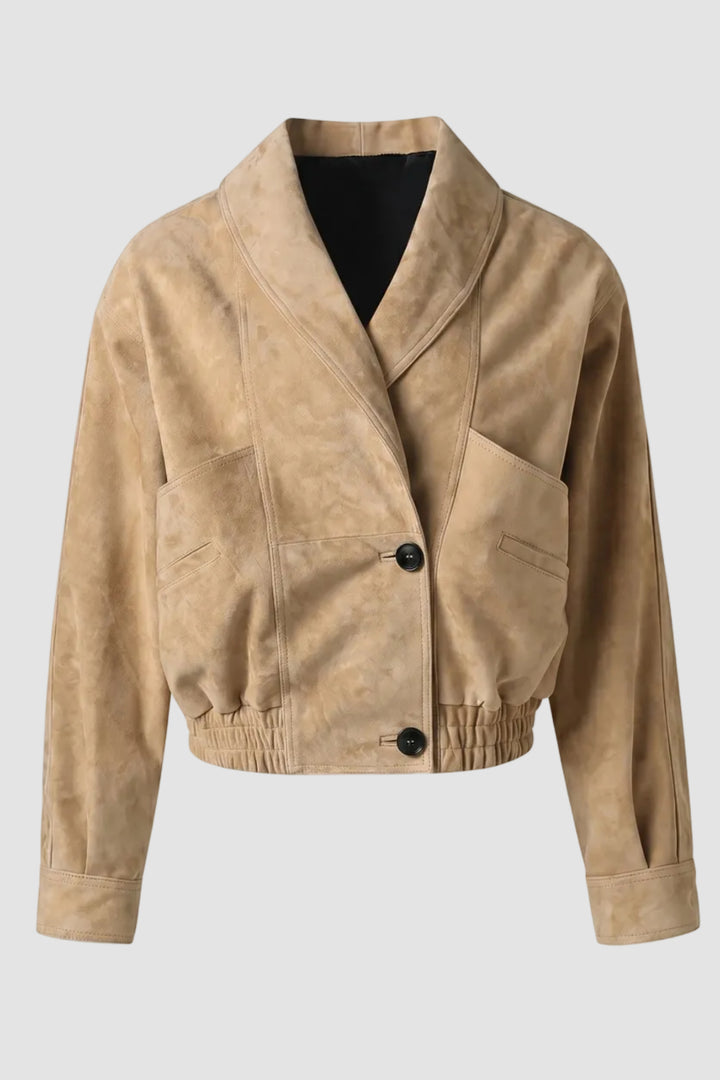 Beige suede jacket with black buttons on a white background