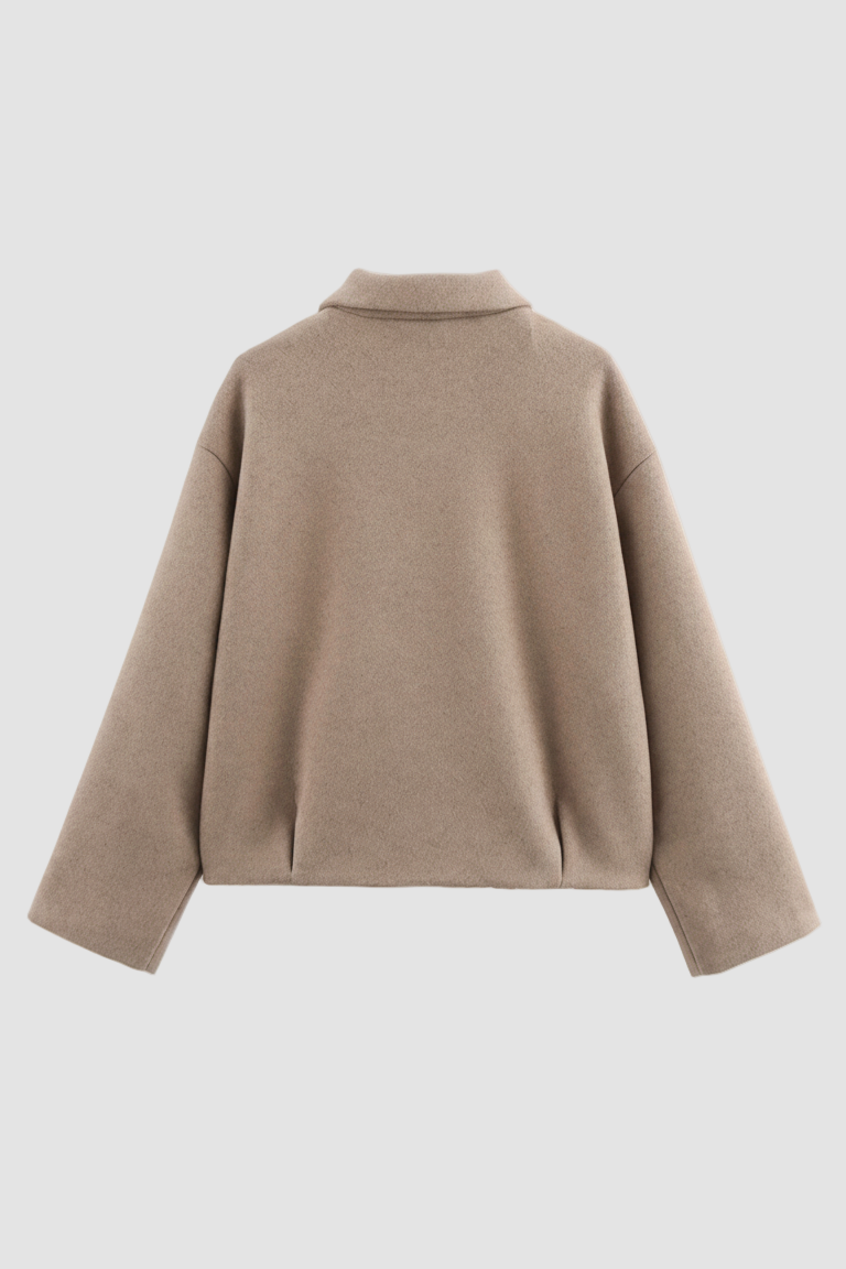 Beige sweater on a white background