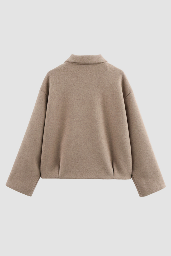 Beige sweater on a white background