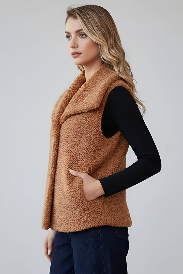 Belted brown faux fur overcoat photographed studio style.