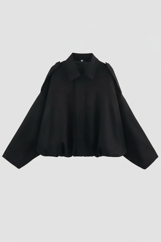 Black blouse on a light gray background