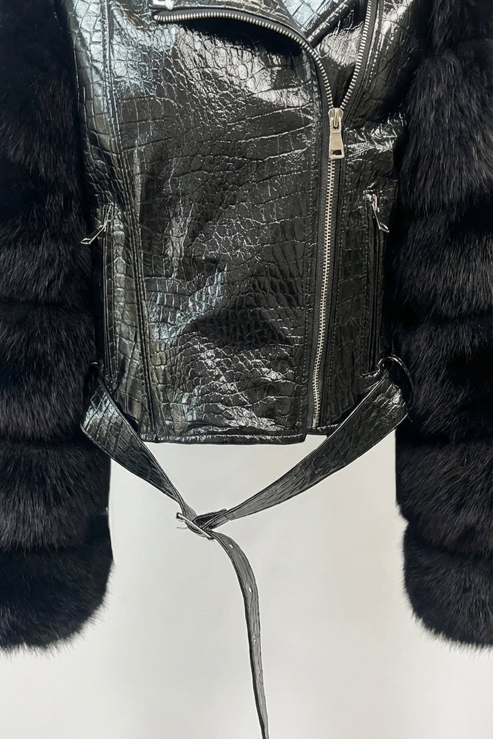 Black leather backpack with fur trim on a white background
