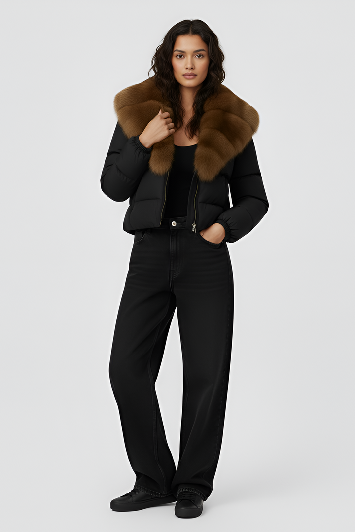 Black puffer jacket with brown fur collar on a light gray background