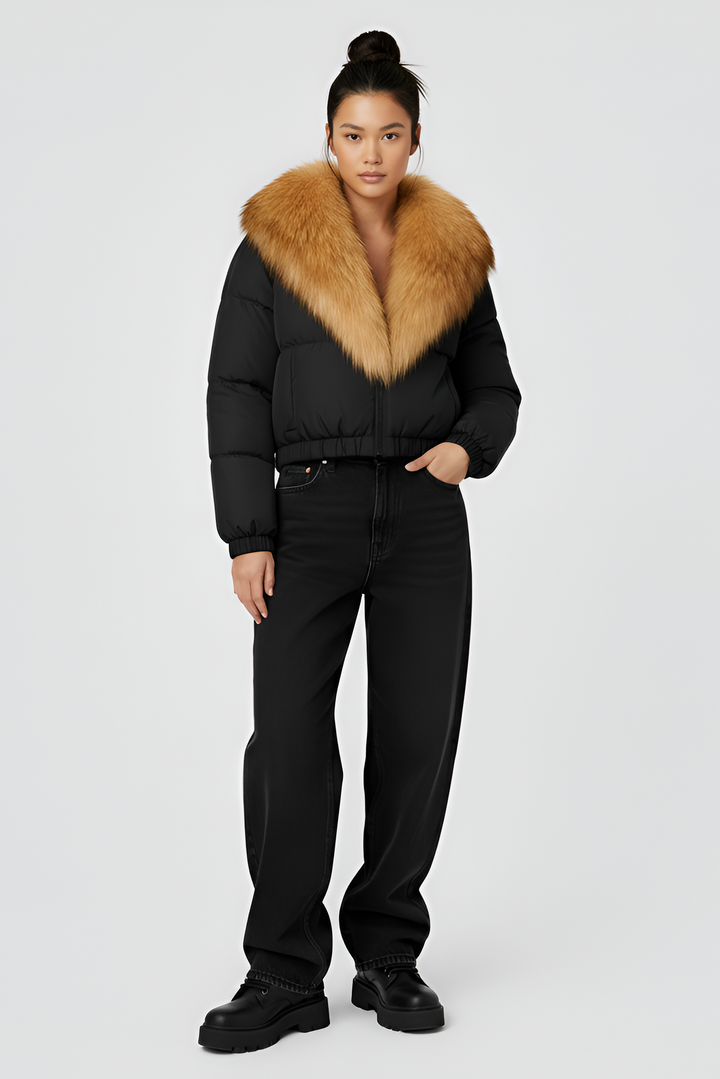 Black puffer jacket with brown fur collar on a light gray background