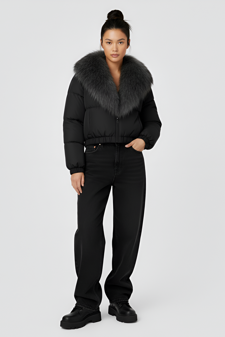 Black puffer jacket with gray fur collar on a light gray background
