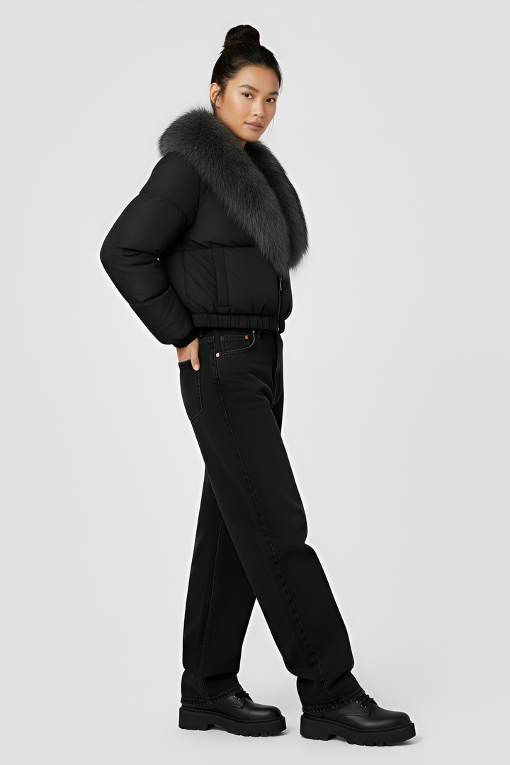 Black puffer jacket with gray fur collar on a light gray background