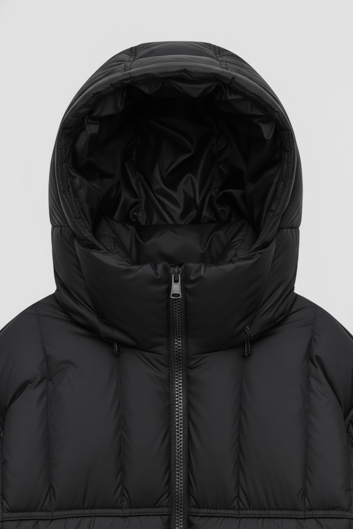 Black puffer jacket with hood on a white background