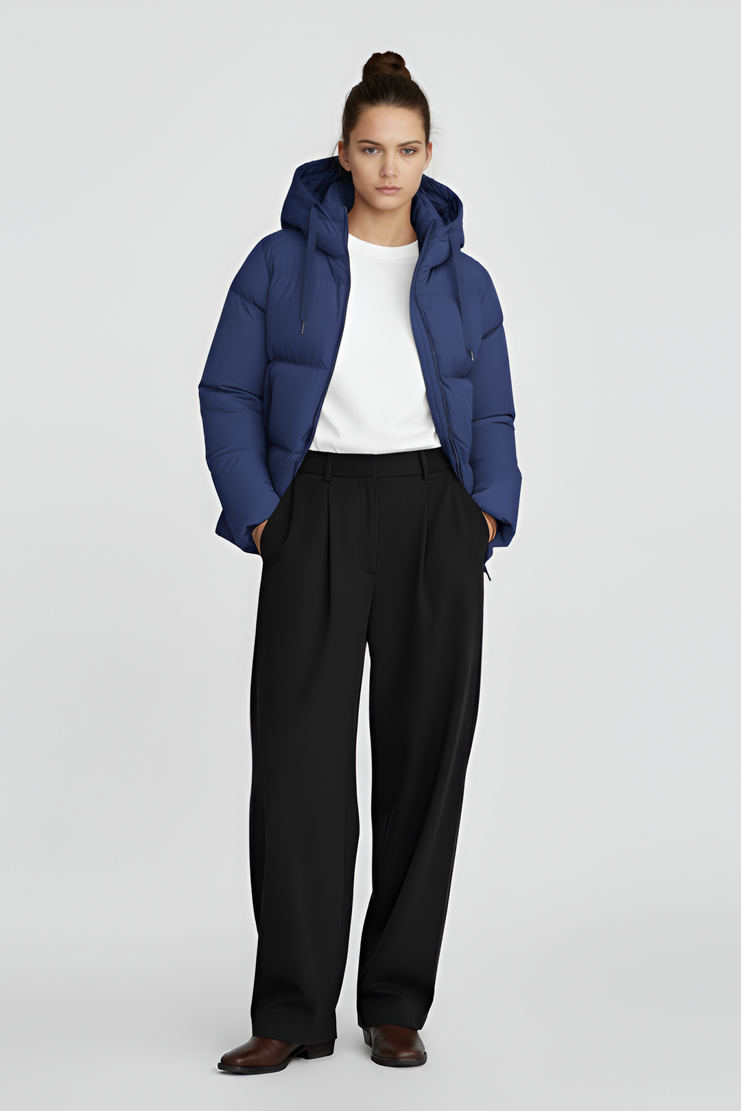 Blue puffer jacket on a light gray background