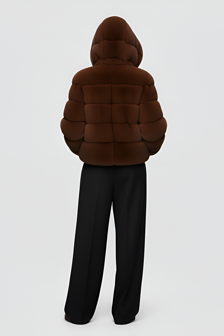 FERALYN faux fur jacket photographed outdoors in natural winter light.