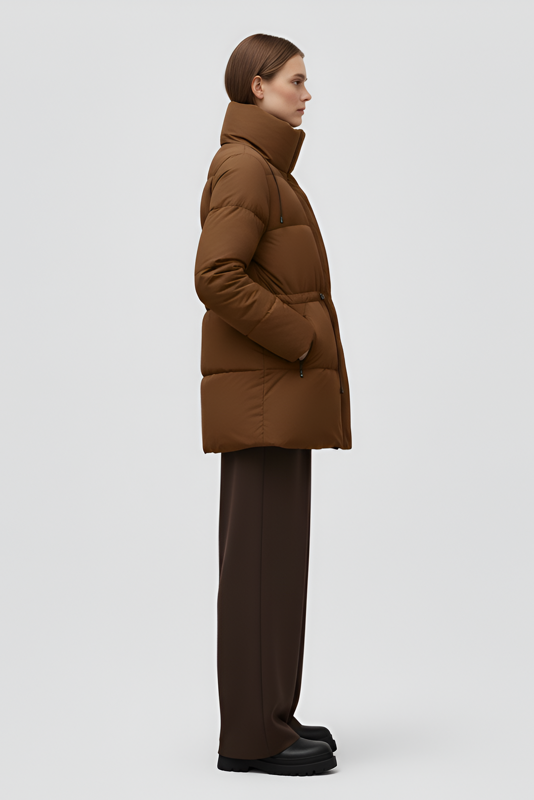 Brown puffer coat on a white background