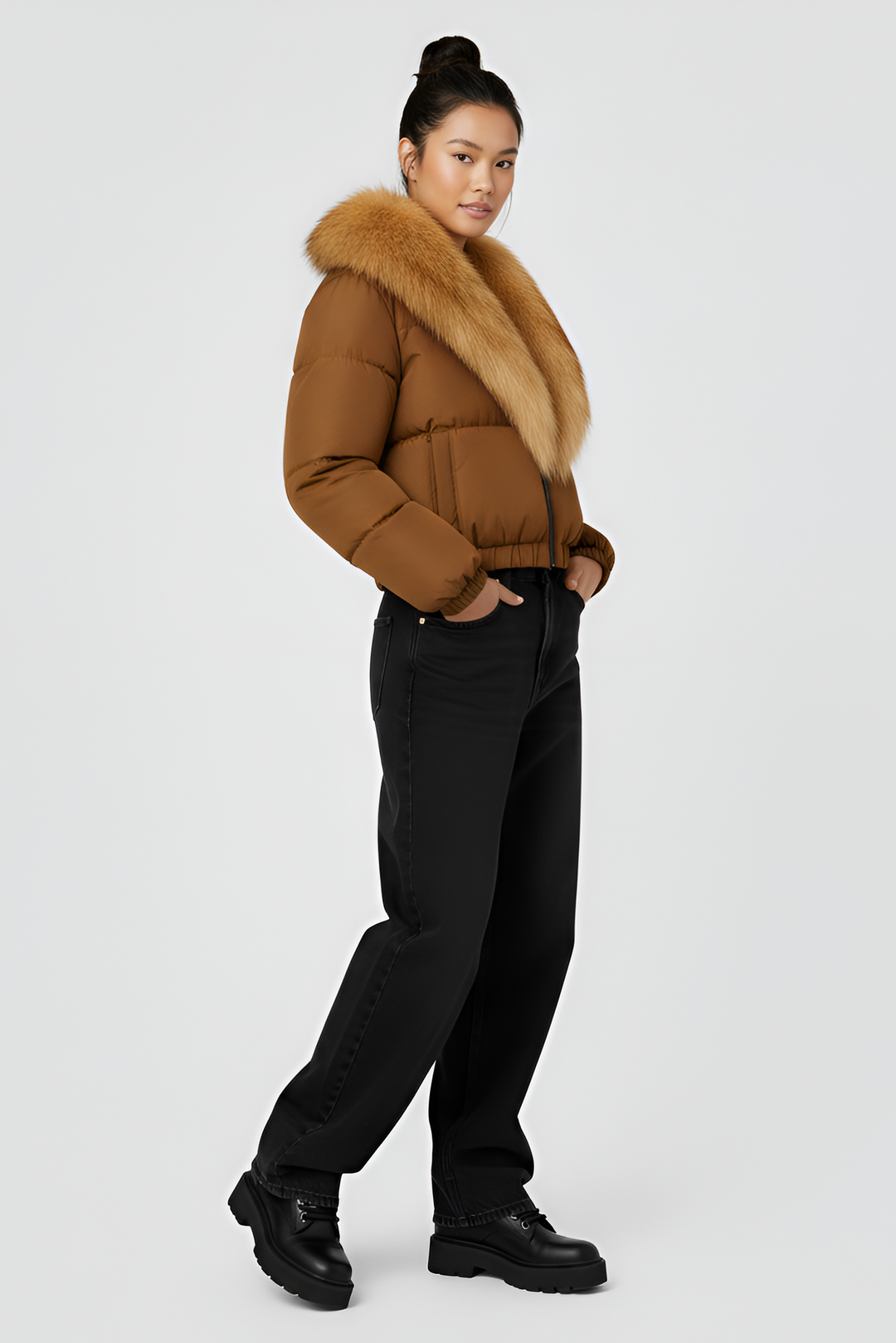 Brown puffer jacket with gray fur collar on a light gray background