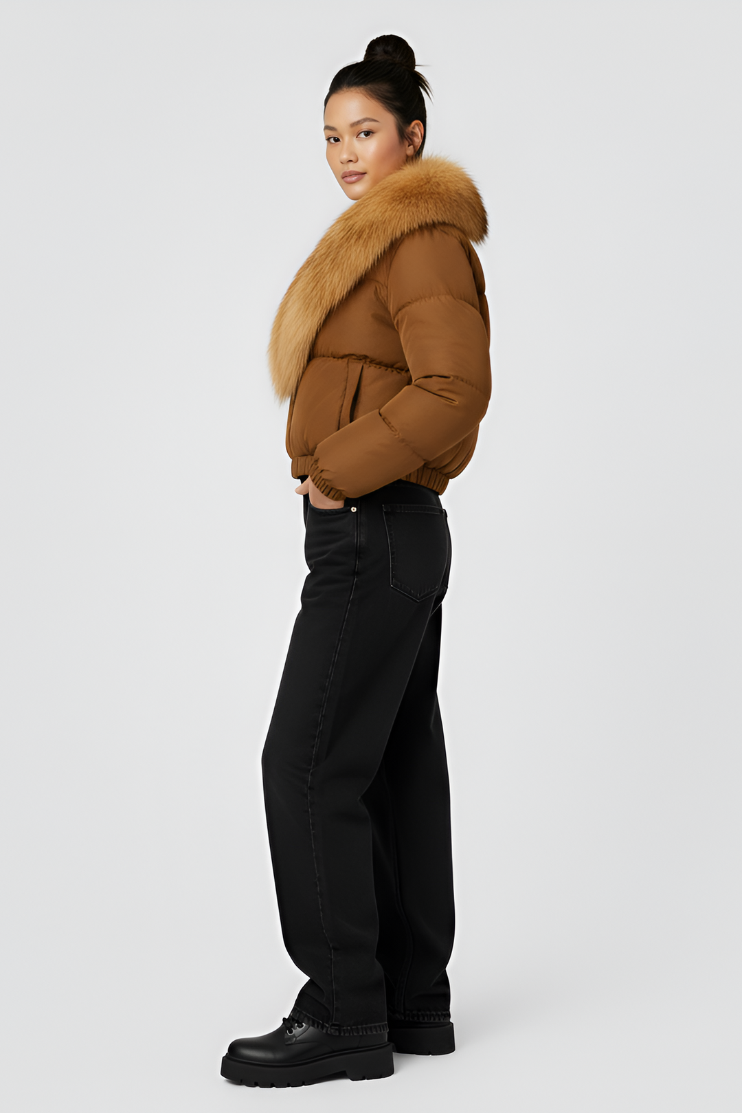 Brown puffer jacket with gray fur collar on a light gray background