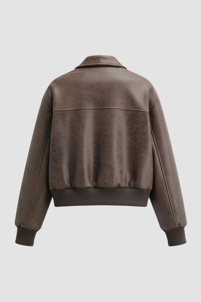 Discover the CARMELIA vintage leather bomber jacket in coffee brown, with oversized pockets, soft lining, and relaxed streetwear fit for spring and autumn.