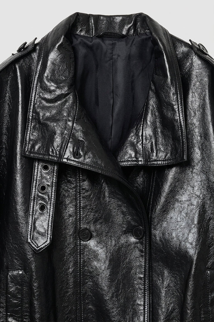 CLAUDINE - Black leather jacket on a light gray background