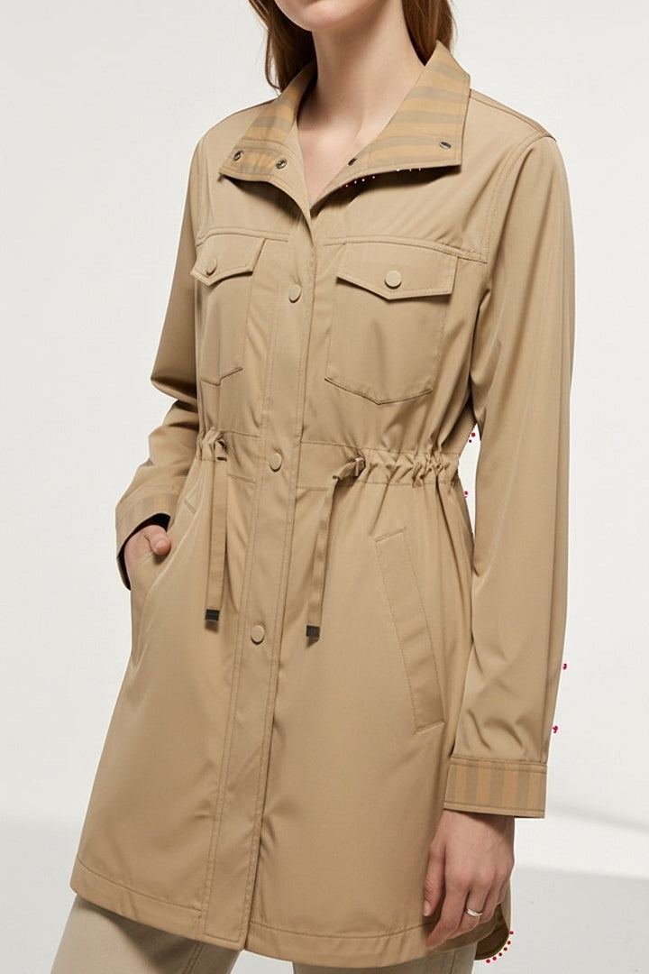 Close-up of EVELON Spring Trench Coat buttons and fabric detailing on waist sash.