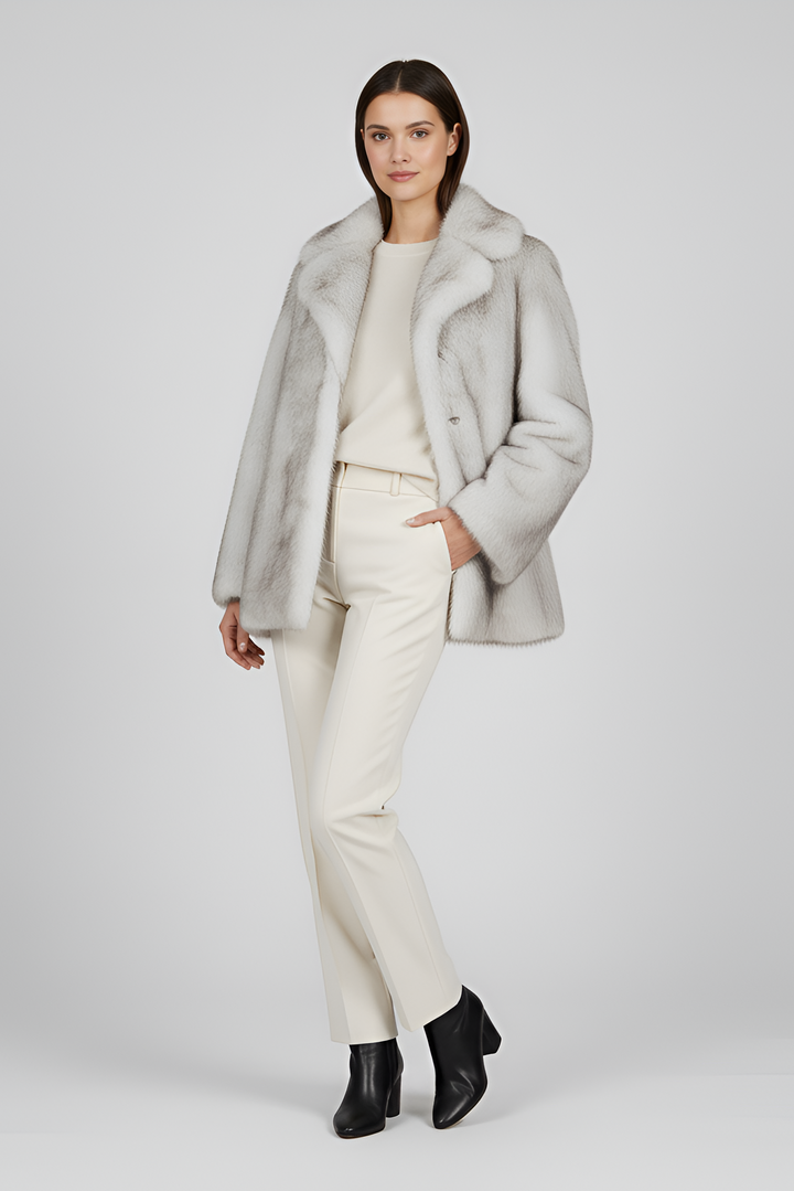 Close-up of LEOVARA coat’s fleece and wool-blend fabric with detailed leopard spots.