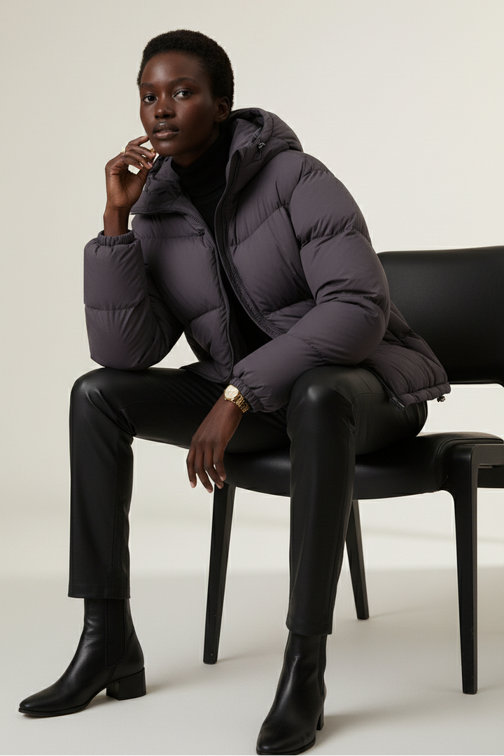 Close-up of LYORE Lightweight Down Jacket showing zipper and soft padded texture.