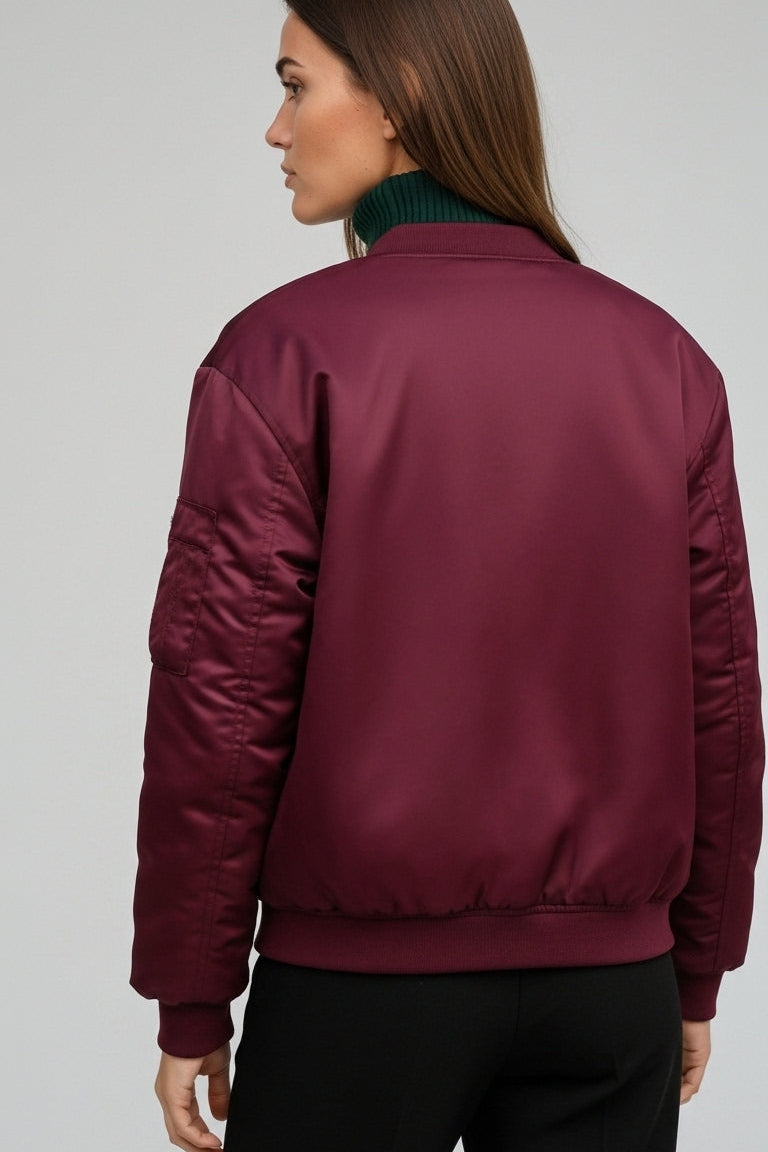 Close-up of LYRIEL Purple Puffer Bomber Jacket zipper, pocket, and soft woven fabric texture.