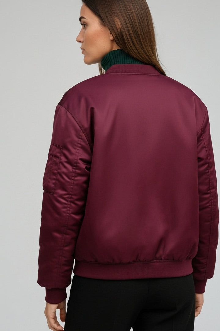 Close-up of LYRIEL Purple Puffer Bomber Jacket zipper, pocket, and soft woven fabric texture.