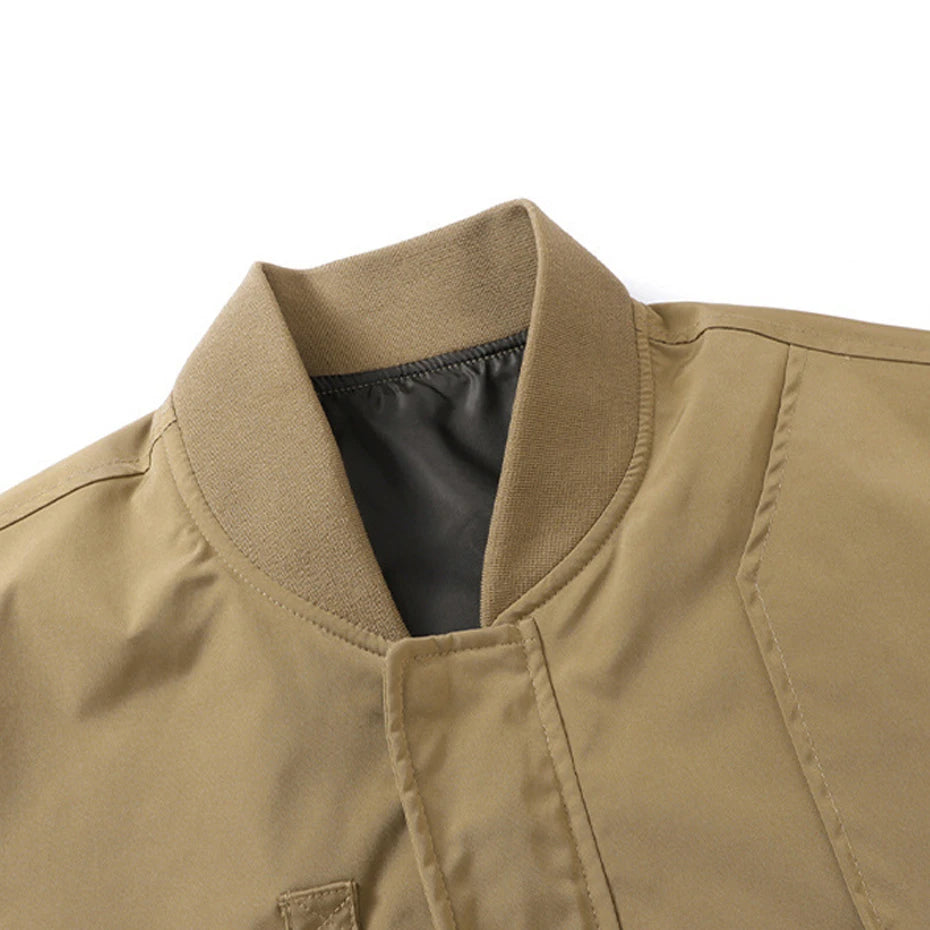 Close-up of a beige jacket collar and chest area on a white background