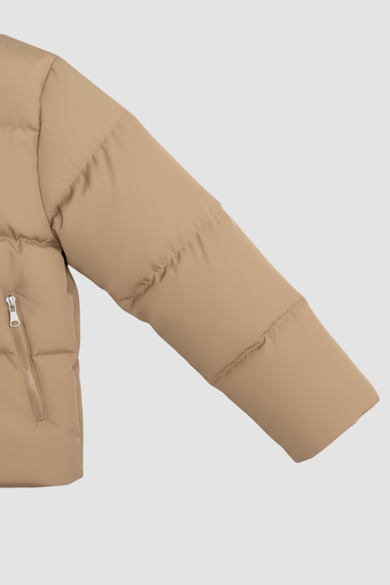 Close-up of a beige puffer jacket on a white background