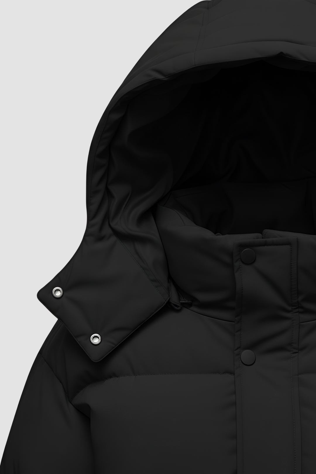 Close-up of a black puffer jacket with a hood on a white background