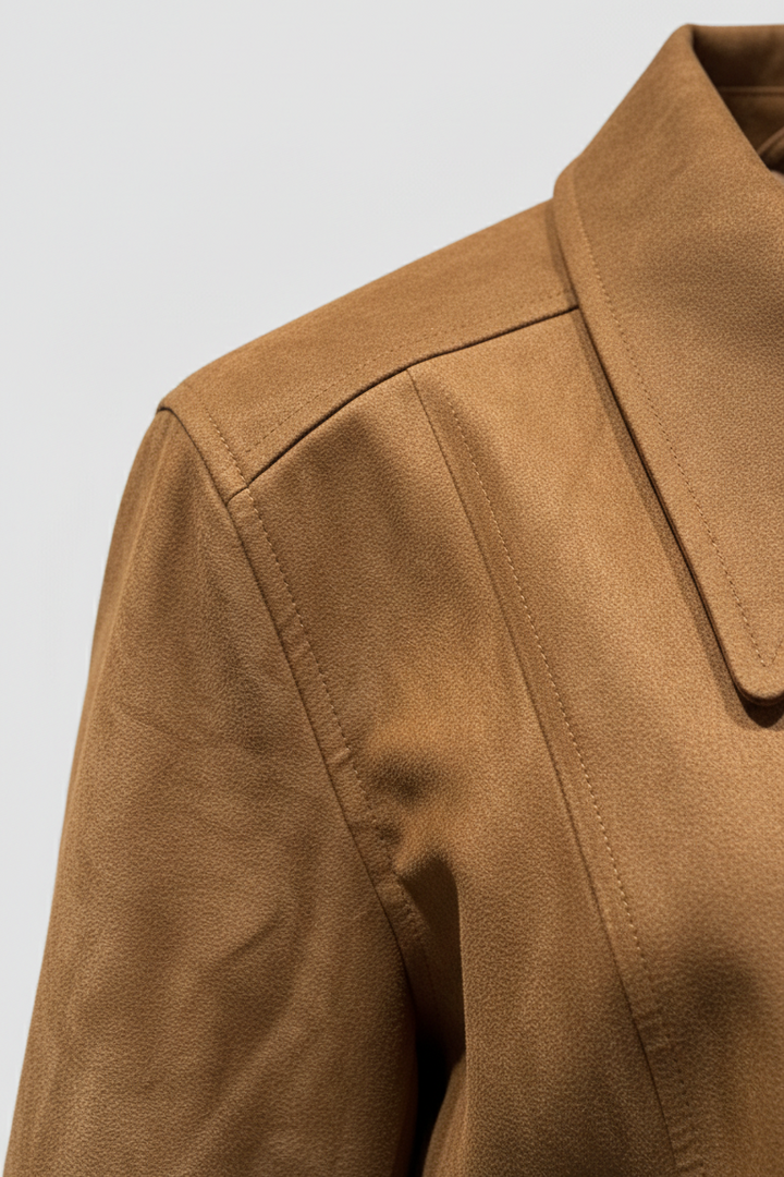 Close-up of a brown jacket on a light gray background
