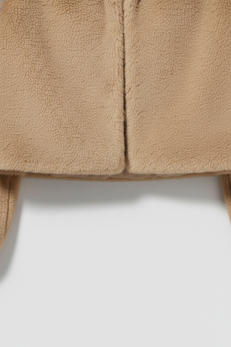 Close-up of beige fleece fabric on a white background