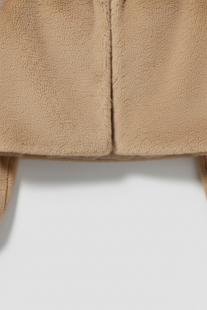 Close-up of beige fleece fabric on a white background