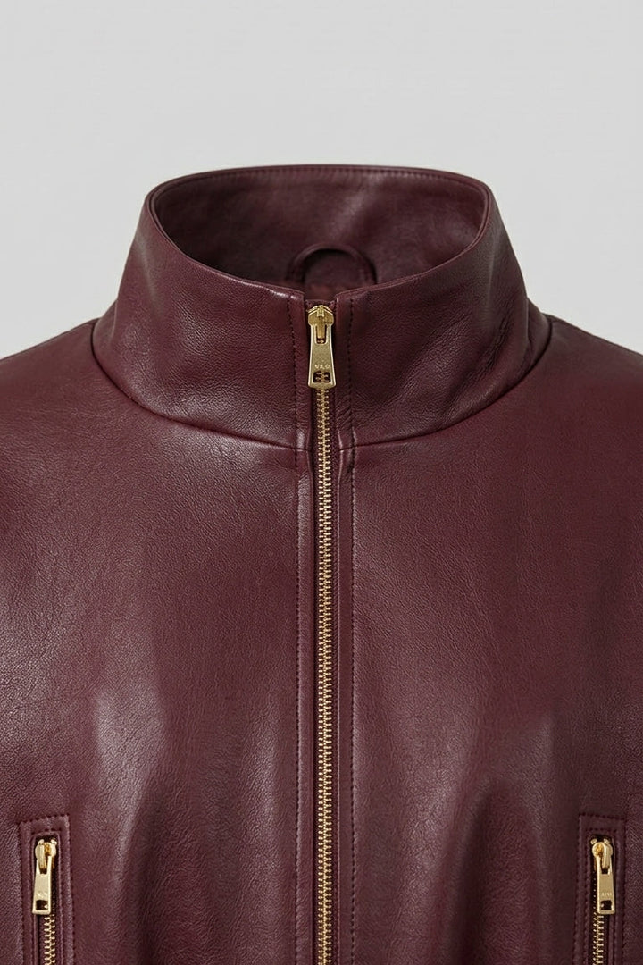 DELILAH - Close-up of burgundy leather jacket collar and zipper