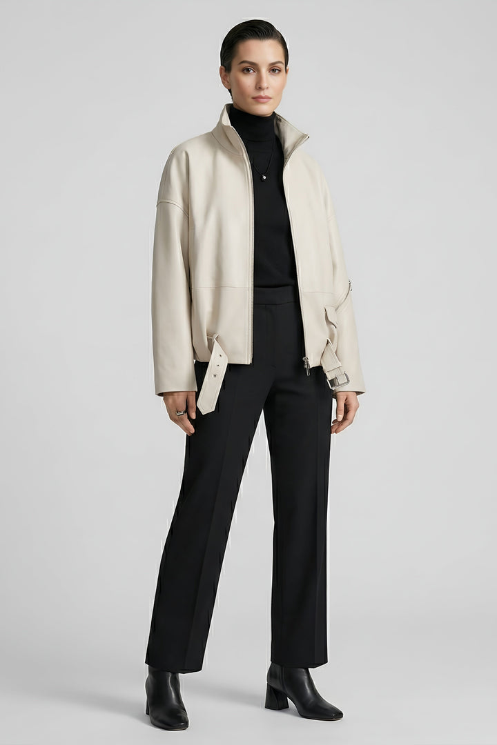 DELILAH - Model posing in a cream leather jacket and black trousers
